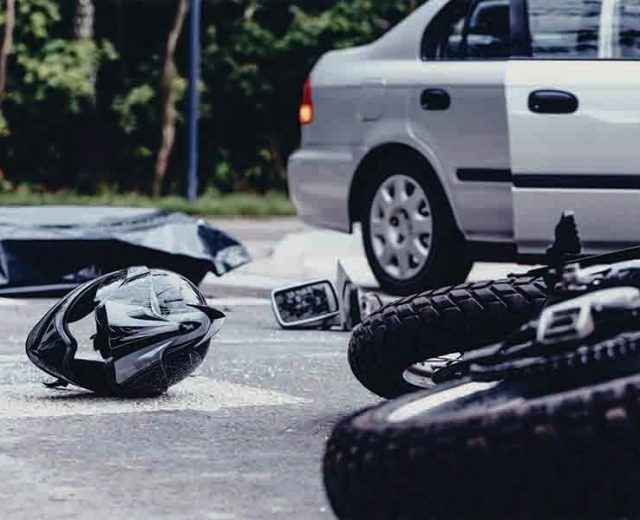 car and motor collision on accident prone road
