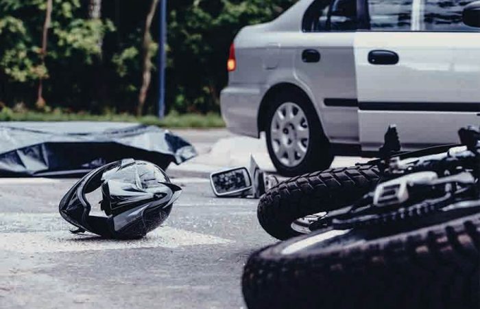 car and motor collision on accident prone road