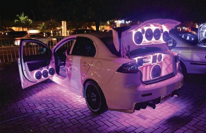 modified car with neon lights and speakers