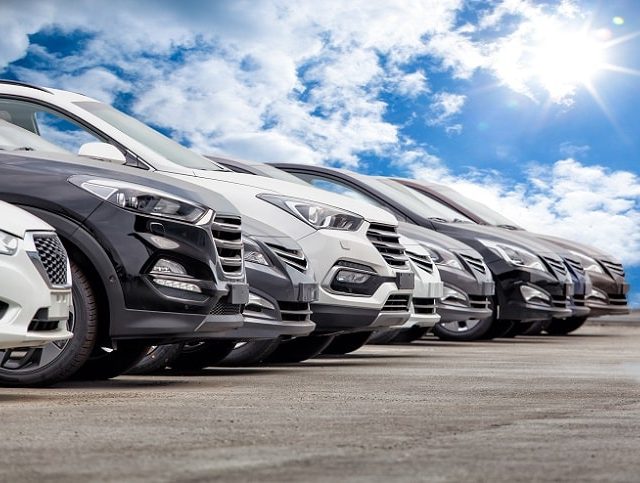 a row of parallel imported cars