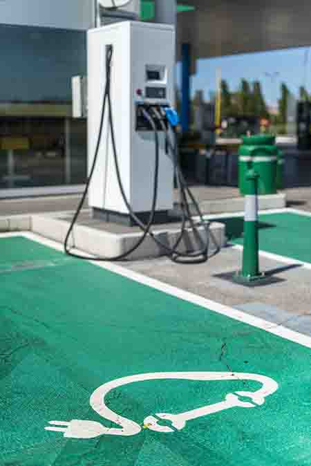 Electric Car Charging At Fuel Station