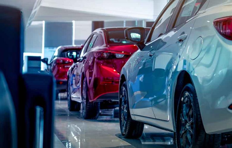 fleet of new cars in showroom