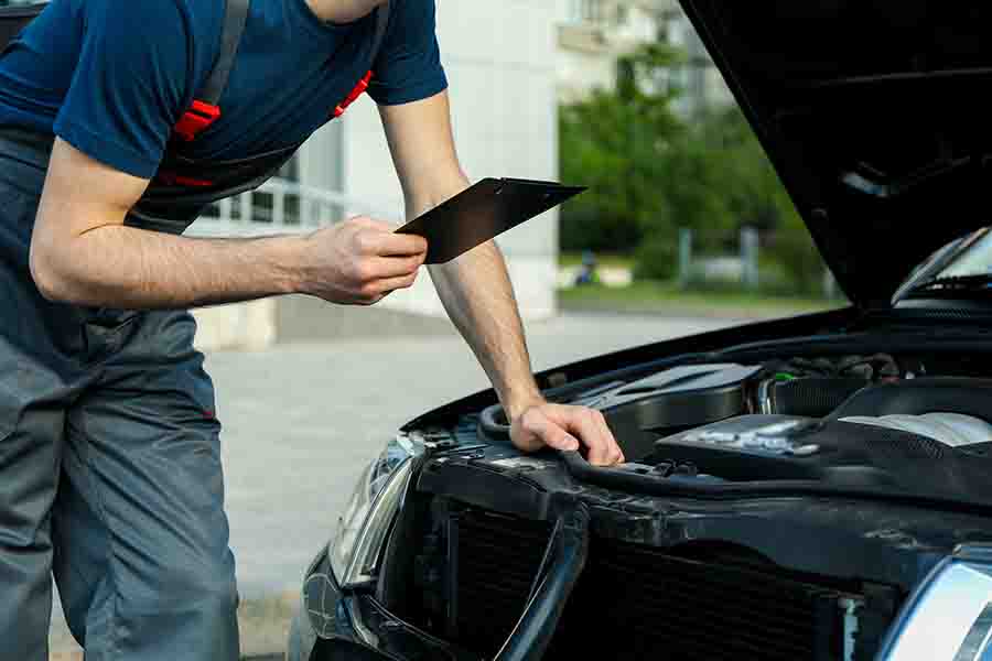 inspecting the condition of the car engine