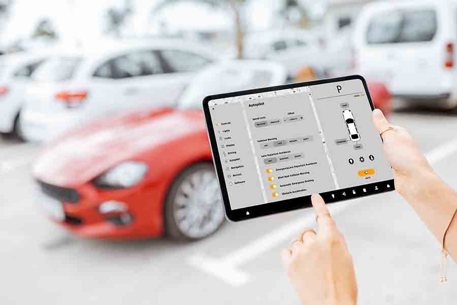 using a tablet to check the condition of the car mechanics