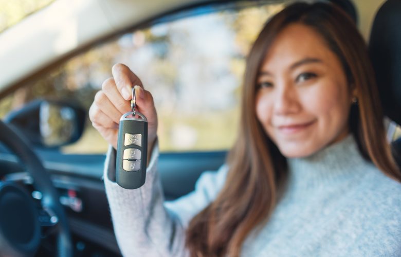 asian woman in her first car