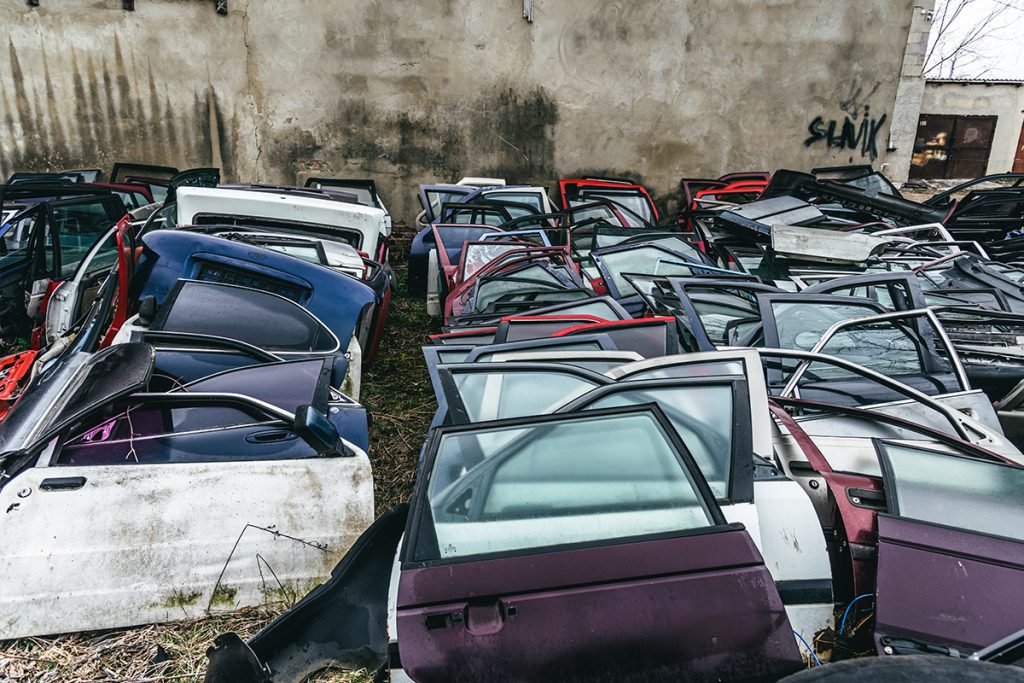 old car doors lined up to be scrapped in singapore